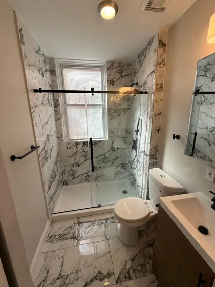 A tiled walk in shower finished by HandyPros
